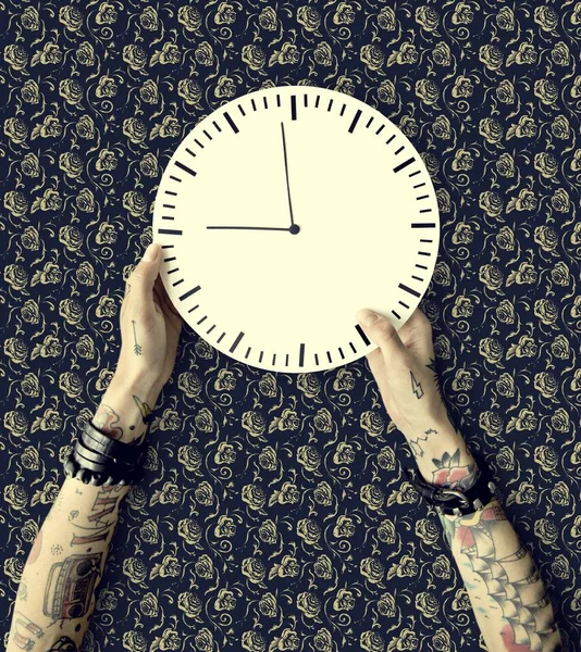 Hands in tattoos with clock — Stock Photo, Image