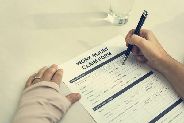 woman writing on paper document