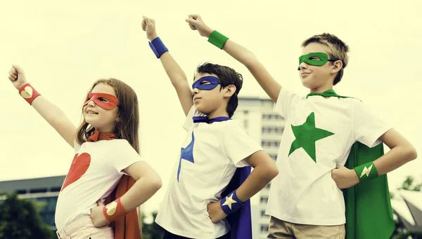 Kids in costumes superheroes — Stock Photo, Image