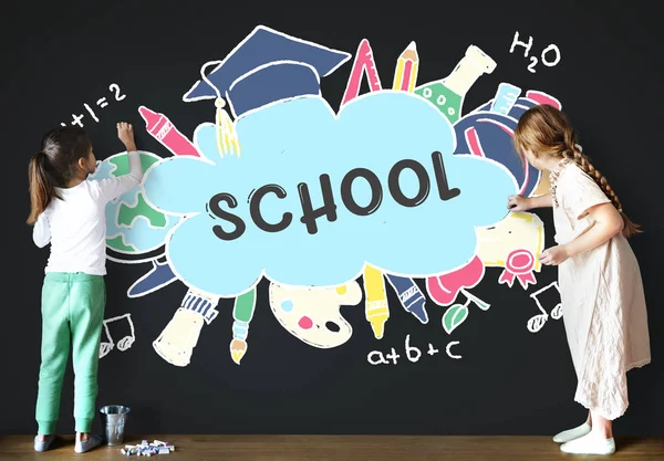 Children drawing on the blackboard — Stock Photo, Image
