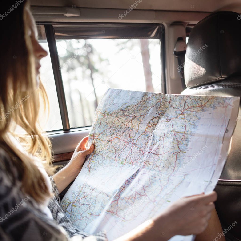 Young Traveler with Map