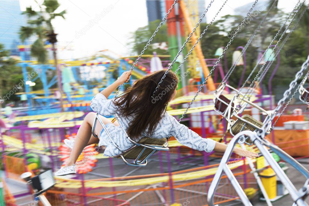 woman on merry go round carousel