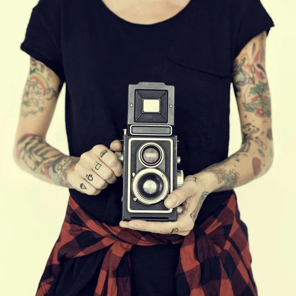 Woman with tattoos posing in studio — Stock Photo, Image