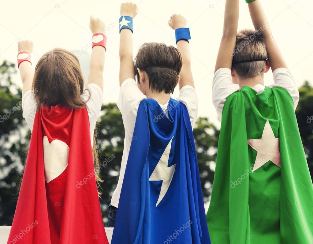 Kids in costumes superheroes