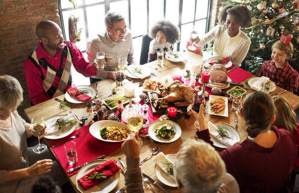 family at table with a festive dinner