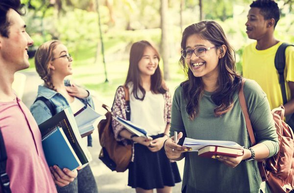 Diverse students studying Outdoors