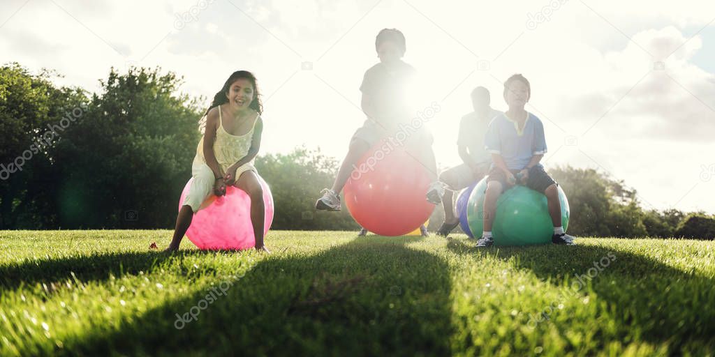 Family jumping on fitness Balls