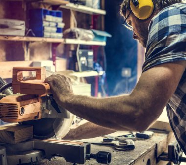 Carpenter Craftman in workshop clipart