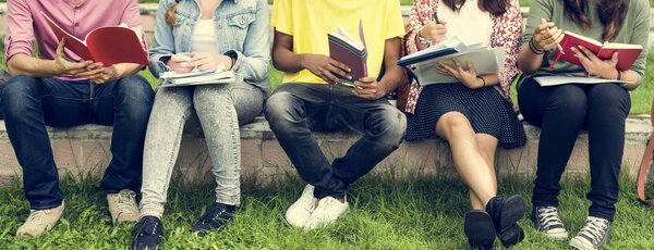 Diverse students studying Outdoors