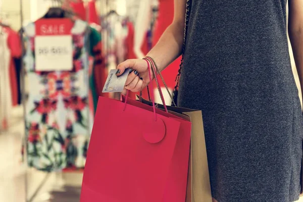 Woman with shopping bags and credit card Stock Image