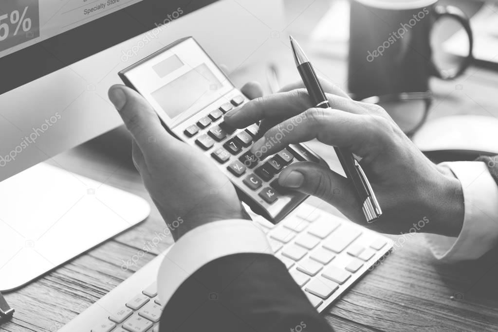 Businessman Accounting on calculator