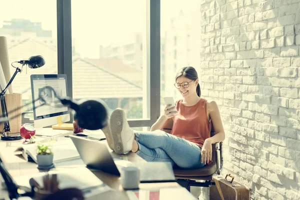 Woman puts feet on table