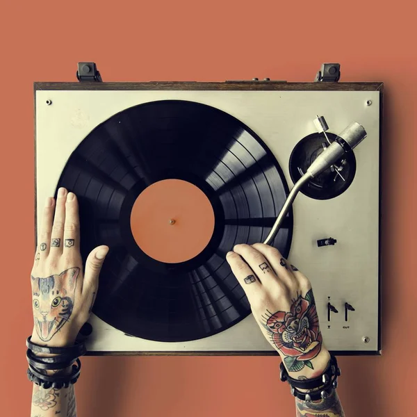 hands in tattoos with Vinyl