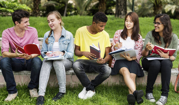Diverse students studying Outdoors