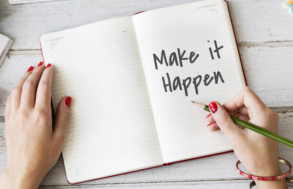 Woman writing notes in diary