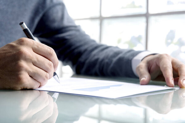 businessman writing notes