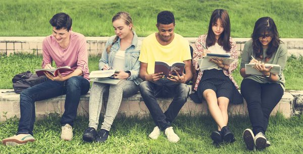 Diverse students studying Outdoors