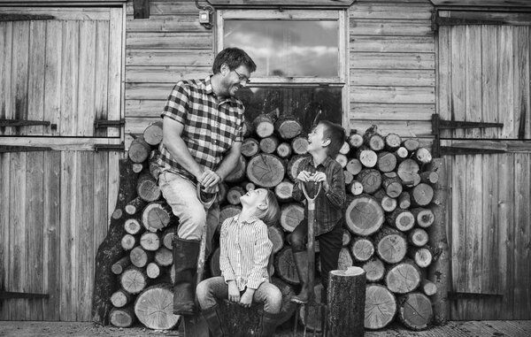 family sitting near Firewood Trunks