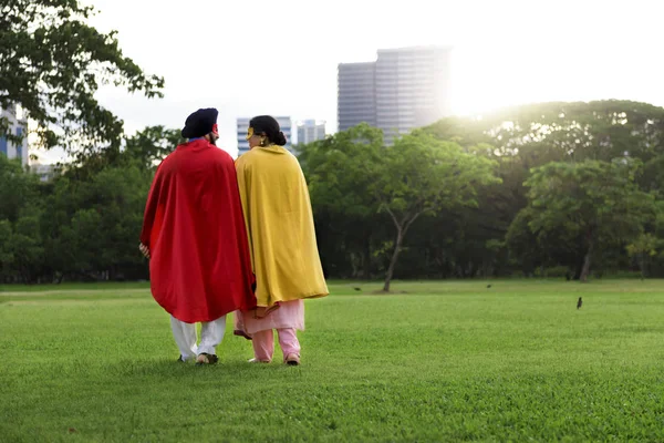 Indian Couple in superhero costumes — Stock Photo, Image