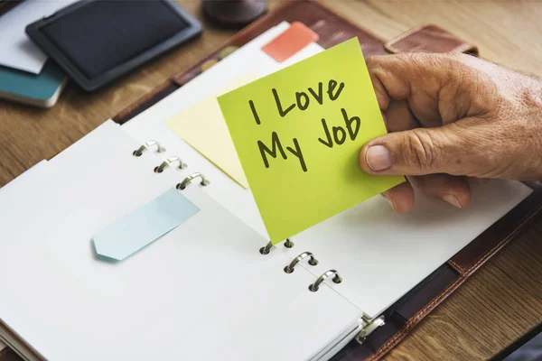 Person holding yellow stick note — Stock Photo, Image