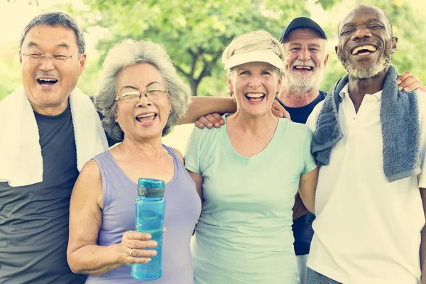 Sportive Senior Friends at park — Stock Photo, Image