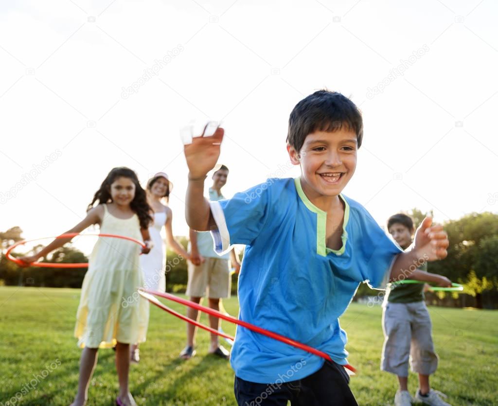 family doing exercise with hula hoops