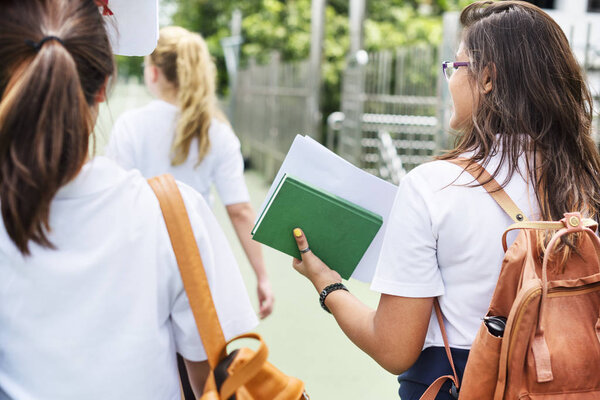 Students in uniform walk together 