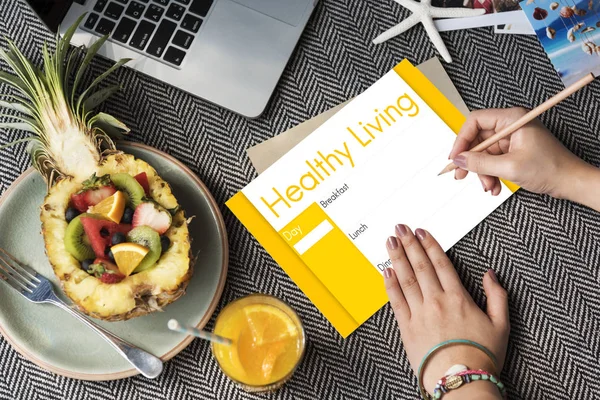 Woman writing wishes on postcard — Stock Photo, Image