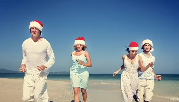 Couples having fun on the beach — Stock Photo, Image