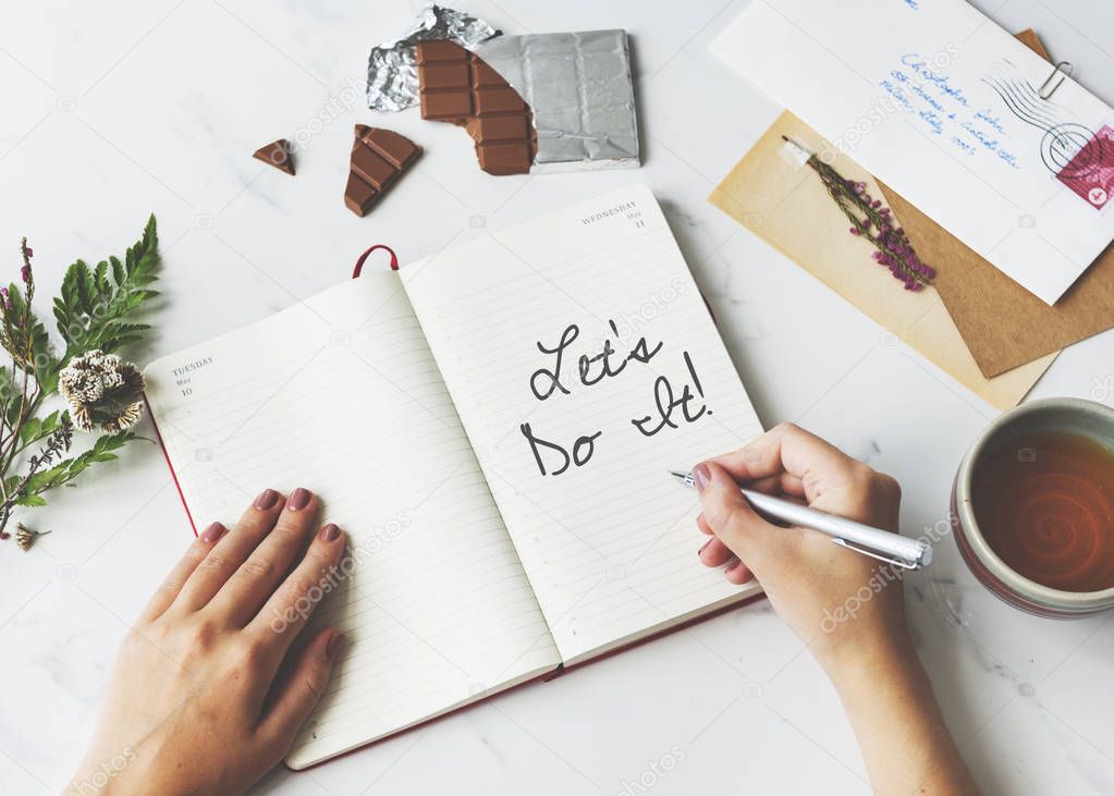 woman writing in notebook