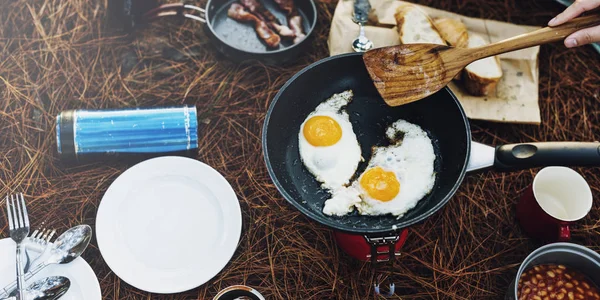 Person cooking eggs — Stock Photo, Image