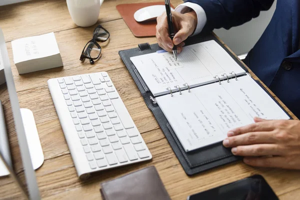 Businessman writing notes — Stock Photo, Image