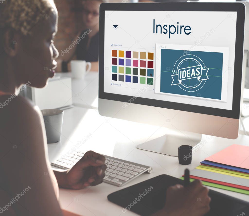 Businesswoman working on computer with Inspire on monitor Concept