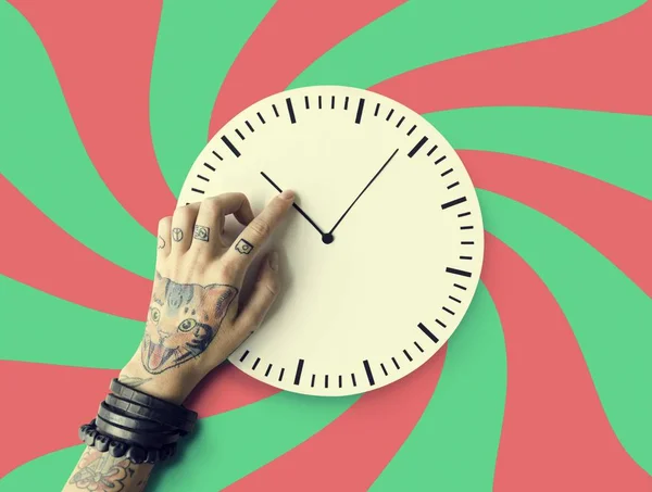 Hand in tattoos with clock — Stock Photo, Image