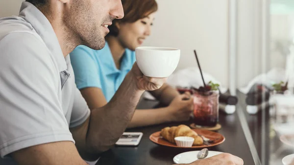 Couple drink coffee in cafe — Stock Photo, Image