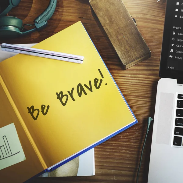 Workplace table with yellow paper diary — Stock Photo, Image