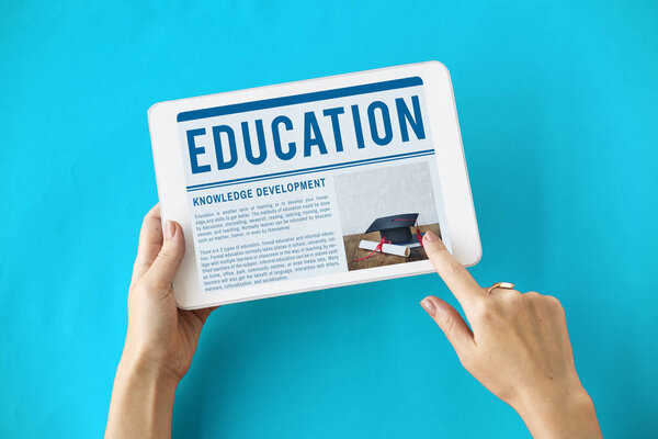 person holding digital tablet