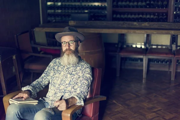 Hipster Man Writer sitting in chair