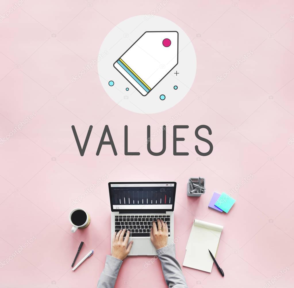 Person working with laptop, cup of coffee, office tools and diary on table with text: Values
