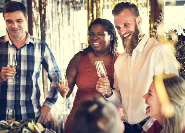 Cheerful people drinking champagne — Stock Photo, Image