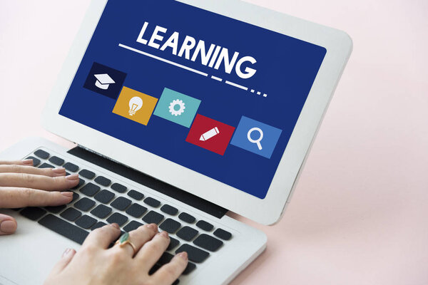 woman typing on laptop keyboard