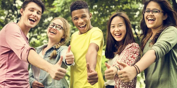 Young Students with thumbs up — Stock Photo, Image