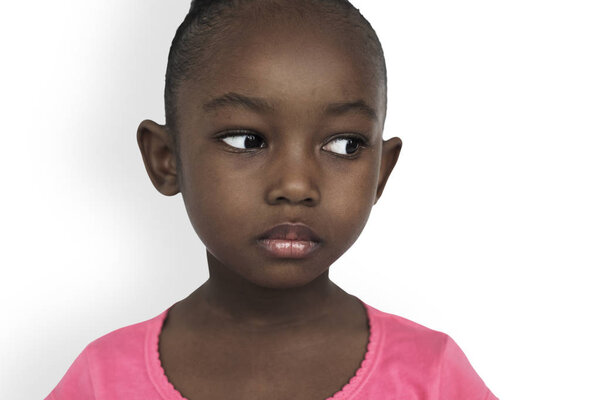 Little african Girl posing in studio, emotion serious Concept