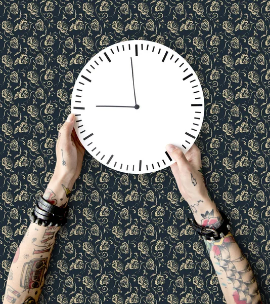 Hands in tattoos with clock — Stock Photo, Image