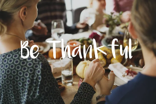 People eating at served table — Stock Photo, Image