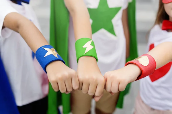 Little kids in costumes superheroes — Stock Photo, Image