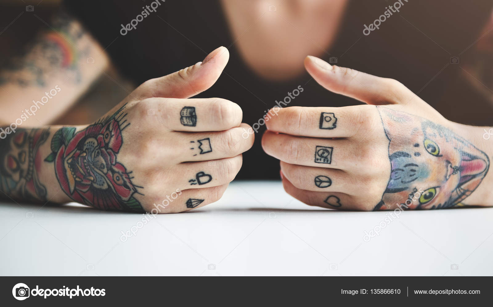 depositphotos_135866610-stock-photo-hands-covered-with-tattoos.jpg