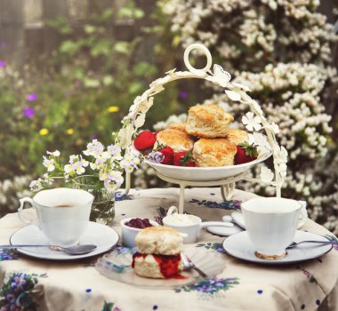 table with tea in Garden clipart