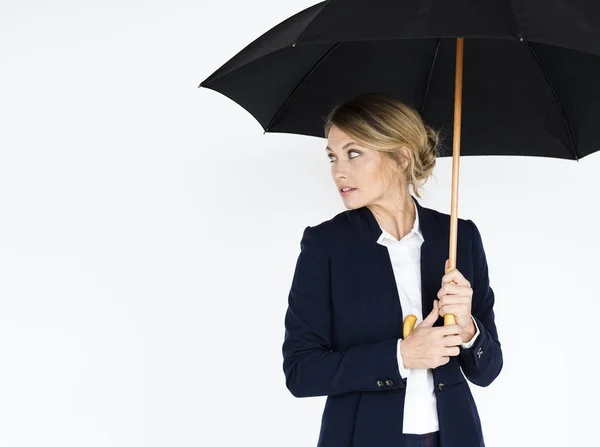 Businesswoman under umbrella — Stock Photo, Image