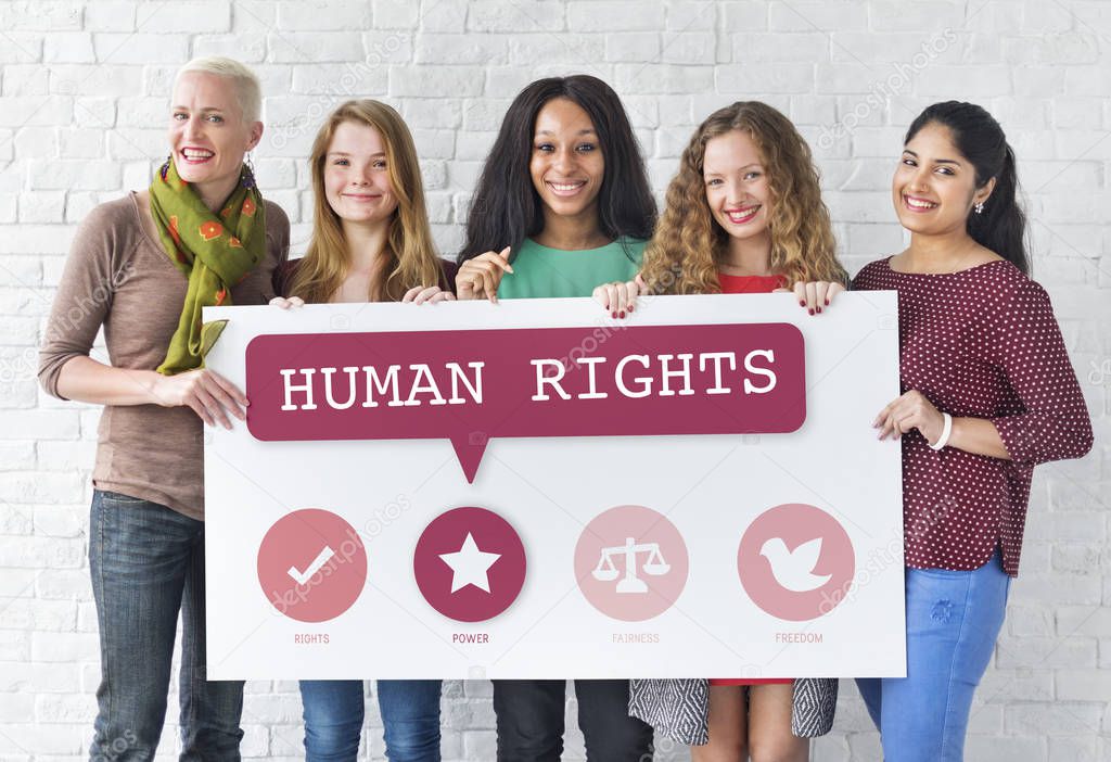 women holding informational board